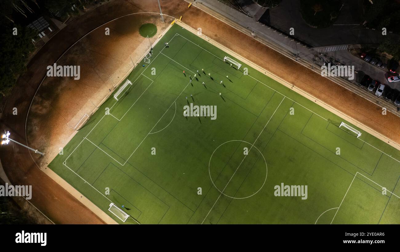 Aerial view of a training in a soccer field at night Stock Photo - Alamy