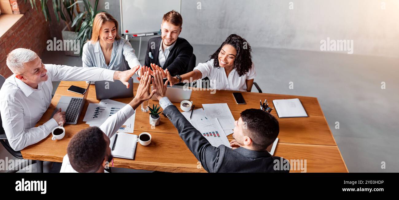 Business Team Giving High-Five Celebrating Success At Work In Office ...