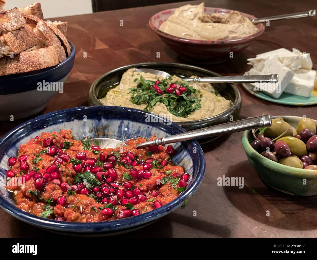 Mezze Platter with Muhammara, Hummus, Baba Ganoush, feta cheese and Olives - Smartphone Captured Stock Image