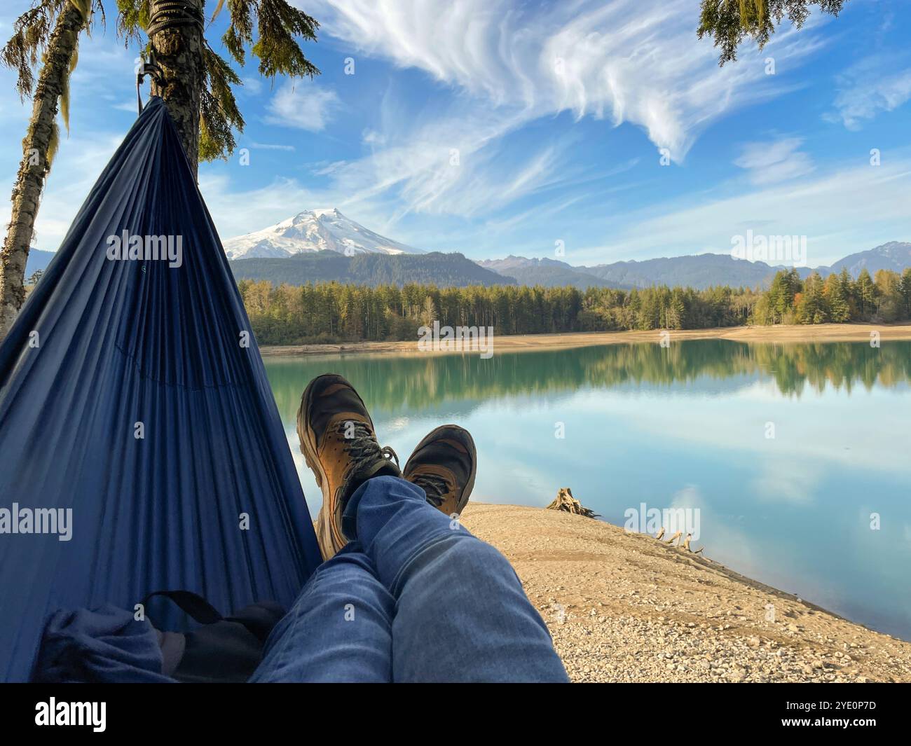 Person in a hammock by Baker Lake, Mount Baker-Snoqualmie National Forest, Washington, USA - Smartphone Captured Stock Image