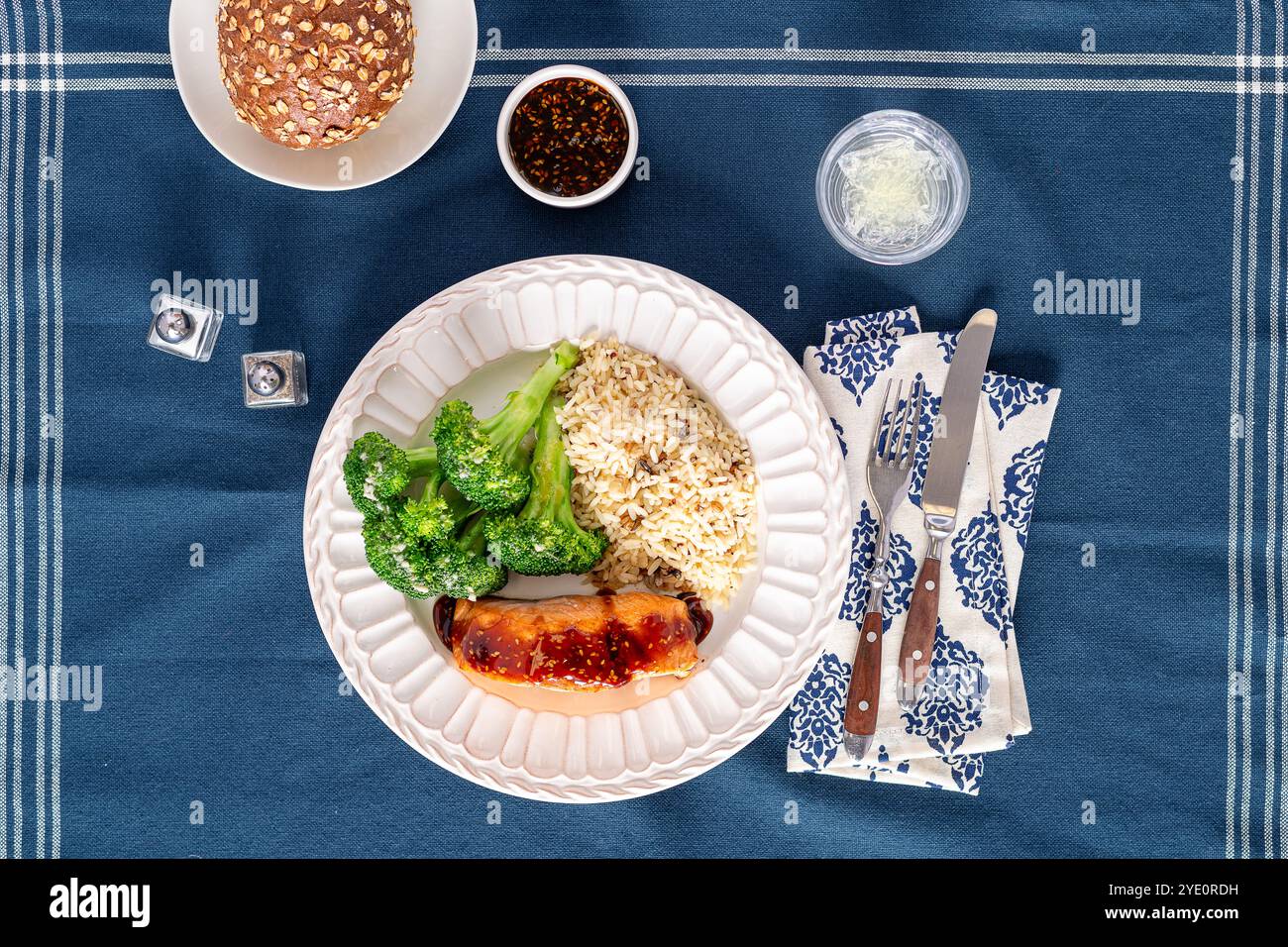 Plated fresh fillet of salmon with teriyaki sauce , rice and vegetables Stock Photo