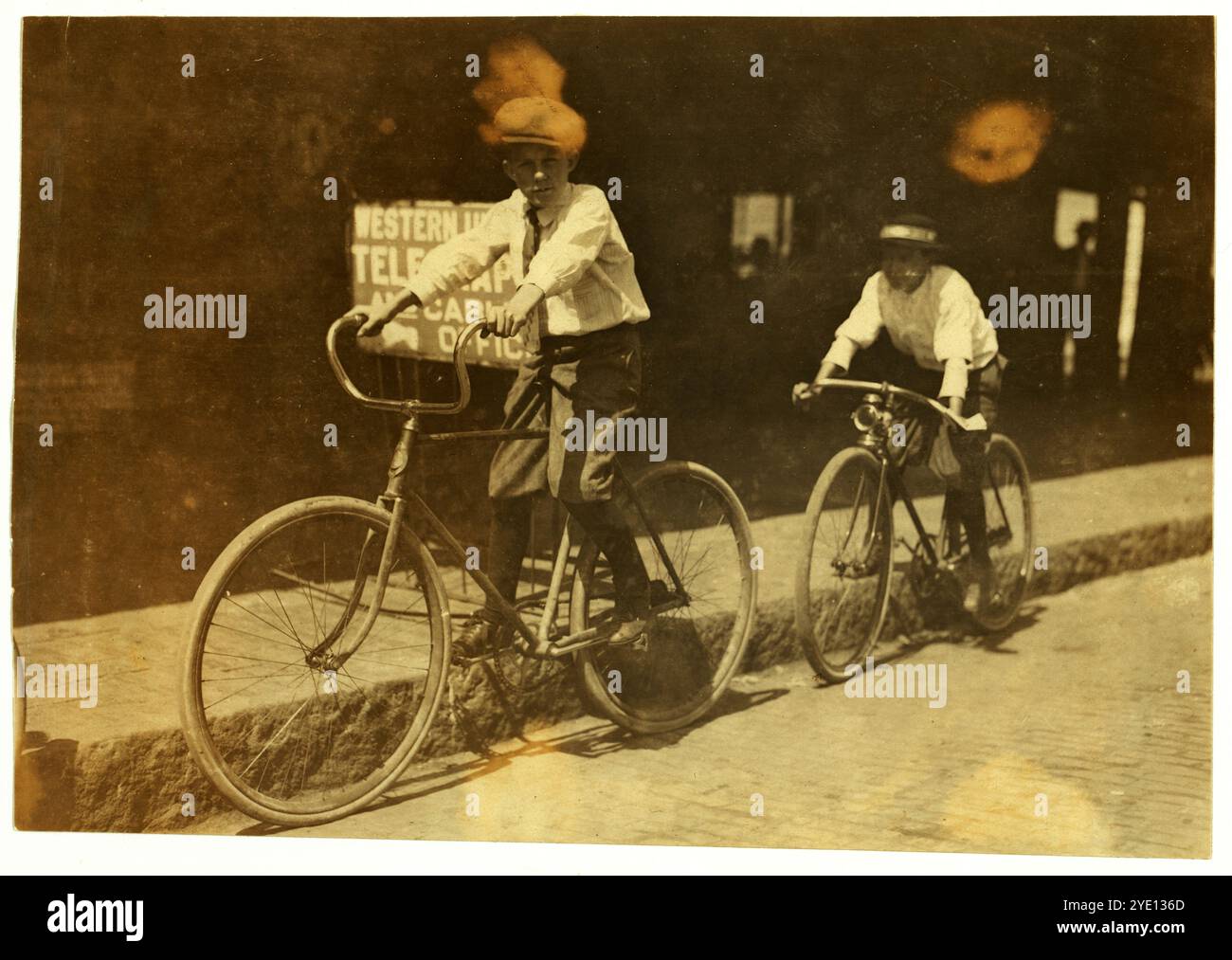 Wilbur Bold, Western Union Messenger No. 14, twelve years old, works until 11 P.M. usually, but all night when they are busy. Location: Tampa, Florida. Photograph by Lewis Wickes Hine, March 1911..   Vintage American Photography 1910s. Child Labour Project.  Credit: Lewis Hines Stock Photo