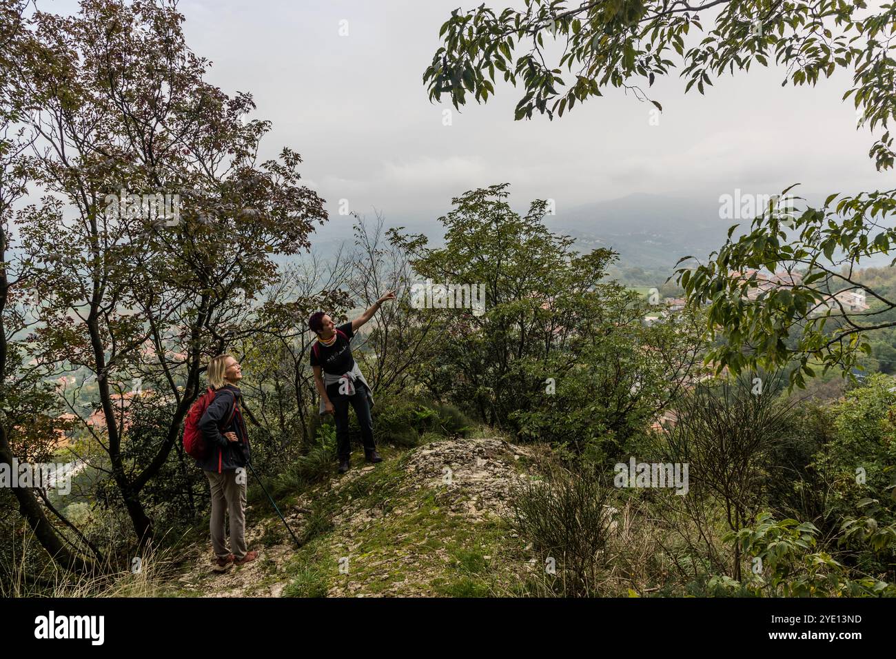Monte Titano is a limestone ridge with a height of 739 meters. The Rupe hiking trail offers views of the towers of San Marino and the surrounding Italian countryside. The Percorso della Rupe hiking trail runs along the flanks of the rock, sometimes very steeply. Sentiero della Rupe, City of San Marino, San Marino Stock Photo