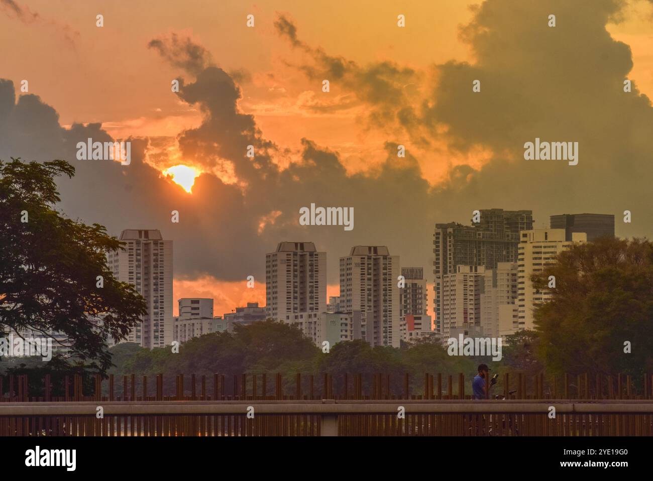 Sunrise and dark clouds at Jurong Lake Gardens in the western part of Singapore. Stock Photo