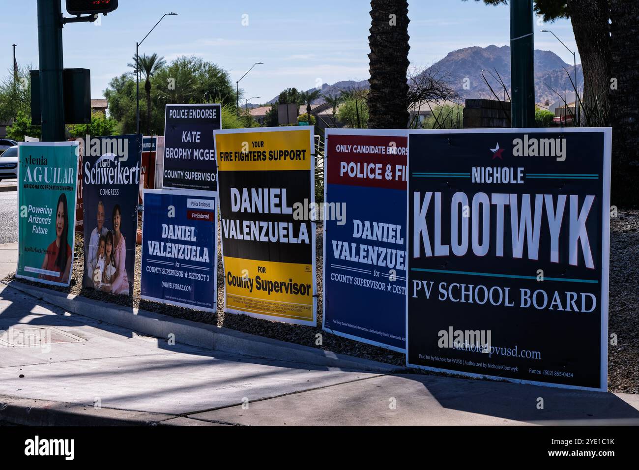 Phoenix Street Corner 10-26-2024 Phoenix, AZ USA  Typlical Street Cormer in the Phoenix Metro area filled with political advertisements for the up com Stock Photo