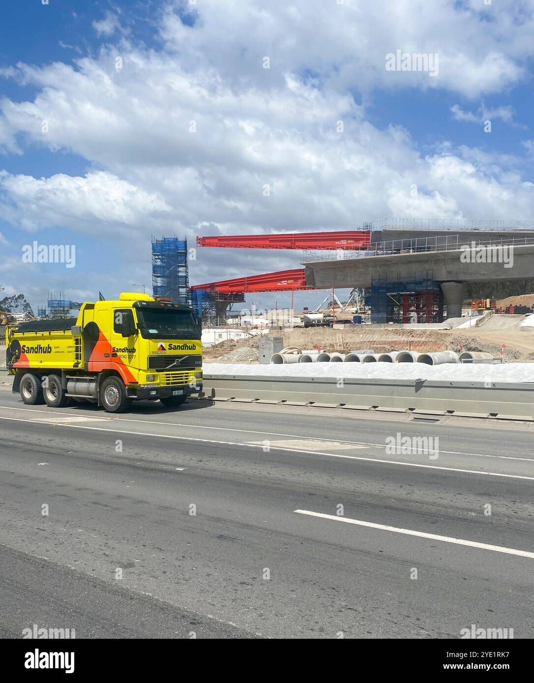 Construction of a viaduct section of the M12 motorway in Western Sydney with a large truck lorry passing,NSW,Australia - Smartphone Captured Stock Image