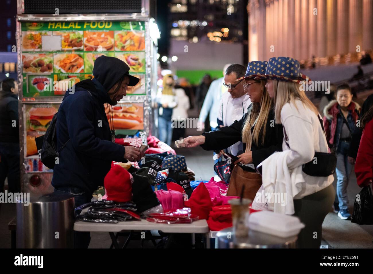 People buying Trump merch from a vendor outside of Donald Trump's rally ...
