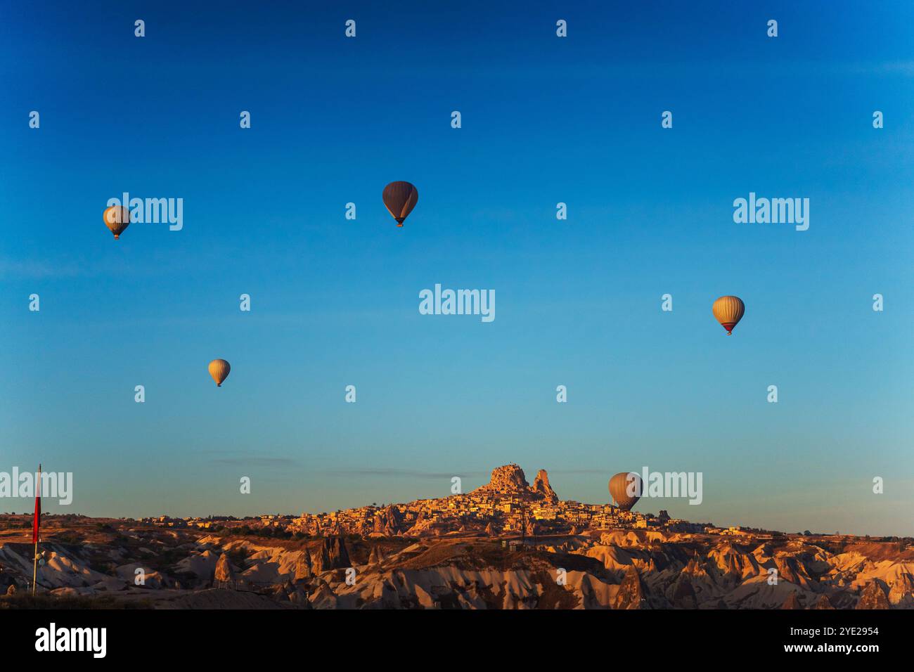 Colorful hot air balloons fly gracefully over a vibrant skyline in ...