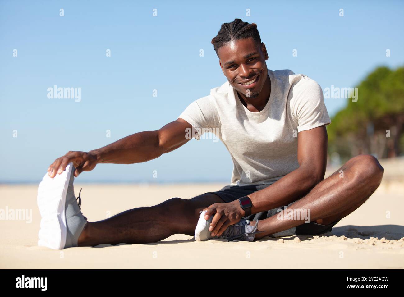 African american jogger stretching legs hi-res stock photography and ...