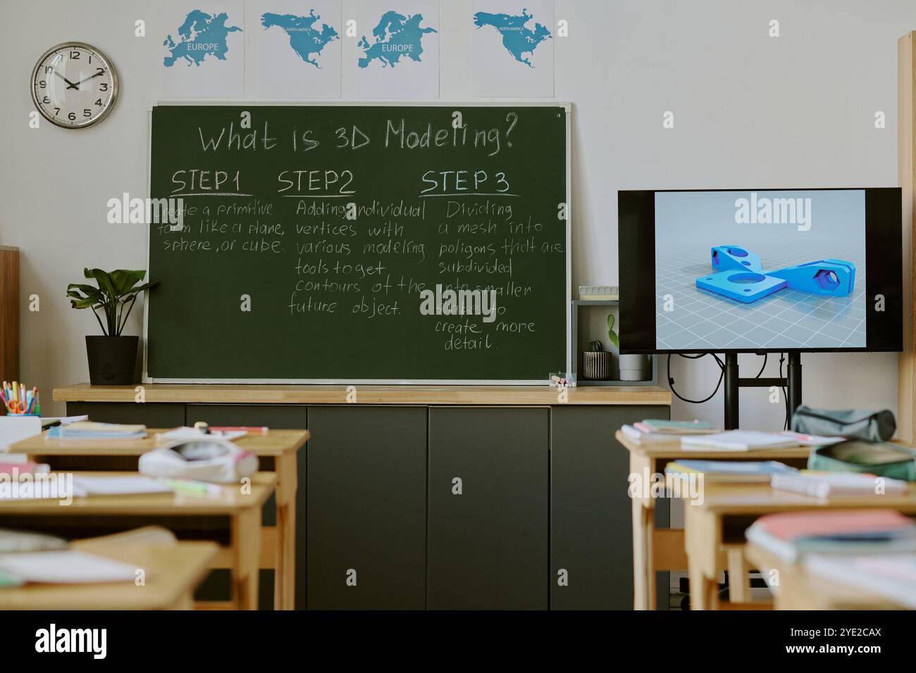 Empty classroom featuring blackboard with 3D modeling steps and digital illustration on screen creating visually educational environment for students Stock Photo