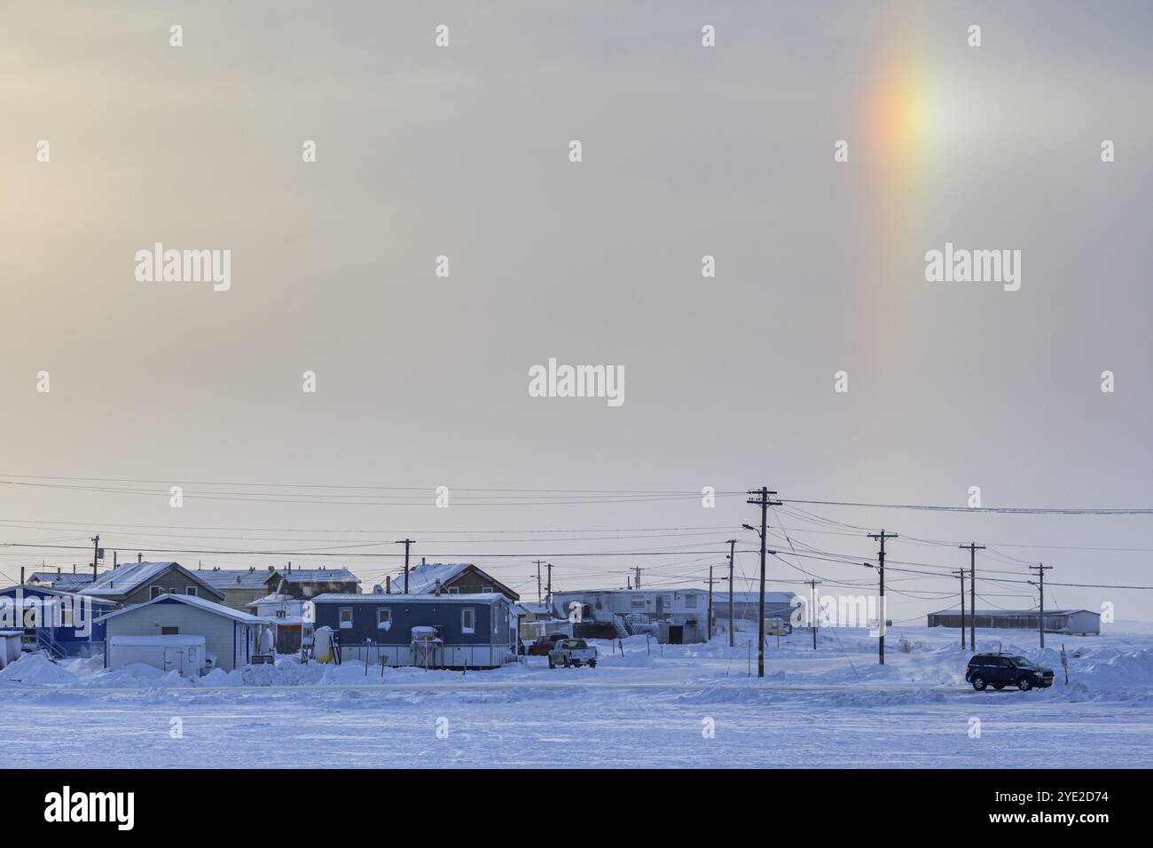 Place, houses, Inuit settlement, sunset, halo effect, Arctic, cold, snow, clouds, Tuktoyaktuk, Northwest Territories, Canada, North America Stock Photo