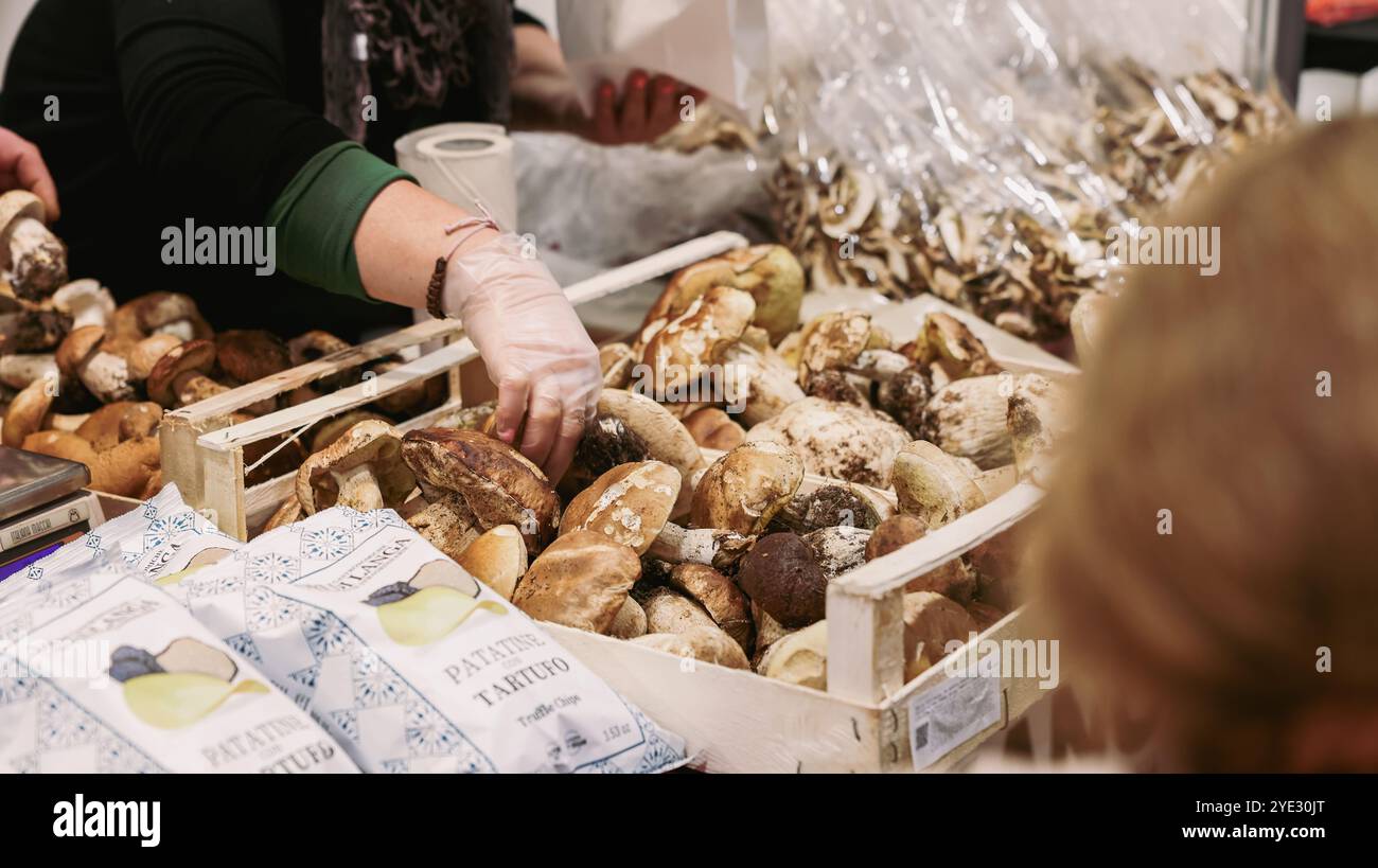 Attendees at the Alba Truffle Festival in Italy examine fresh truffles ...