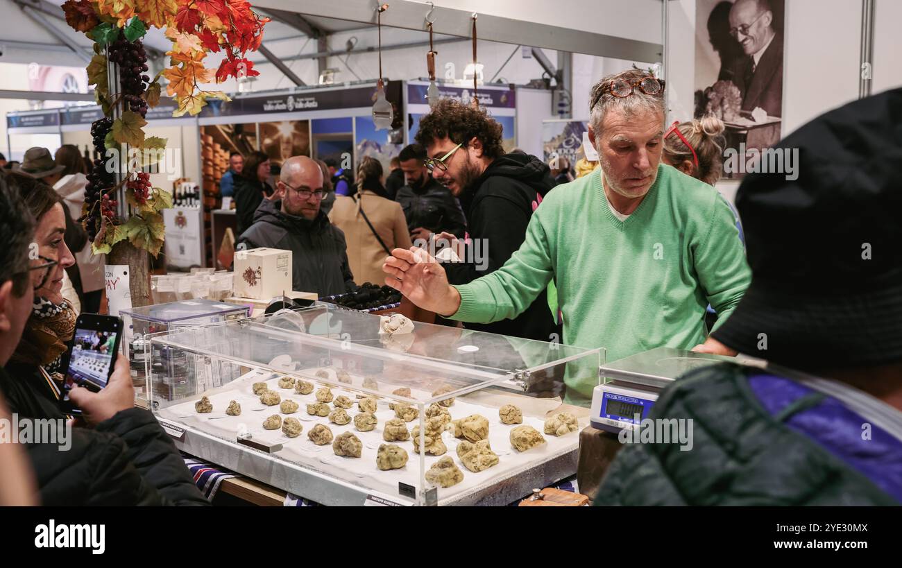 At the Alba Truffle Festival, a dedicated vendor showcases a variety of ...
