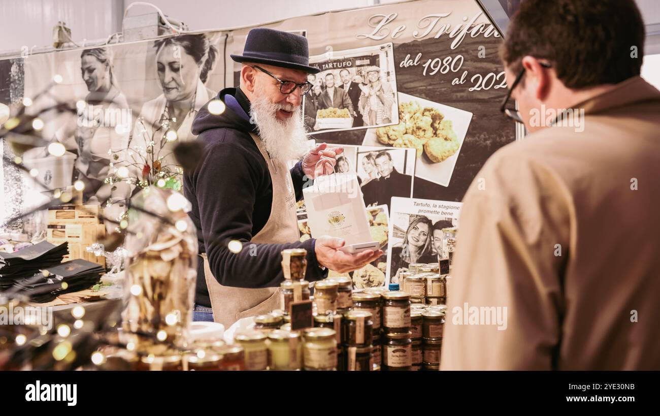 At the Alba Truffle Festival in Italy, visitors engage with local ...