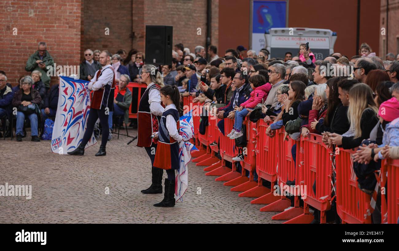 A lively cultural festival in Alba, Italy draws a large crowd, as performers prepare to showcase their talent Stock Photo