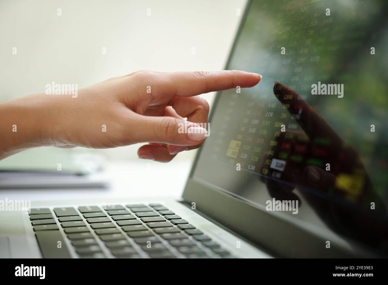 Analyzing Financial Data on Modern Laptop Screen Stock Photo