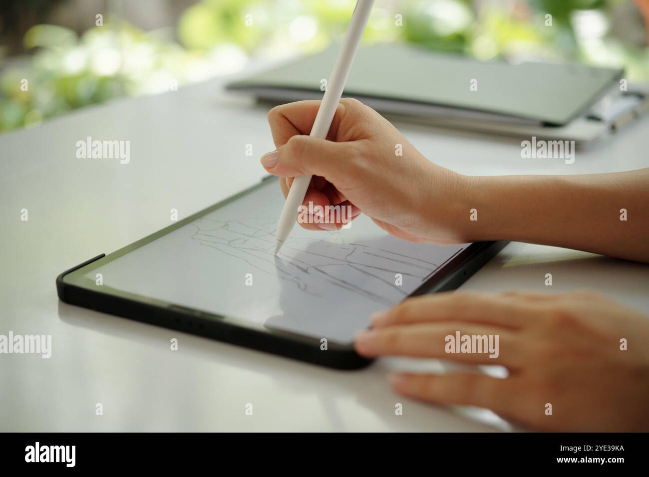 Using Digital Pen for Artistic Design on Tablet Stock Photo