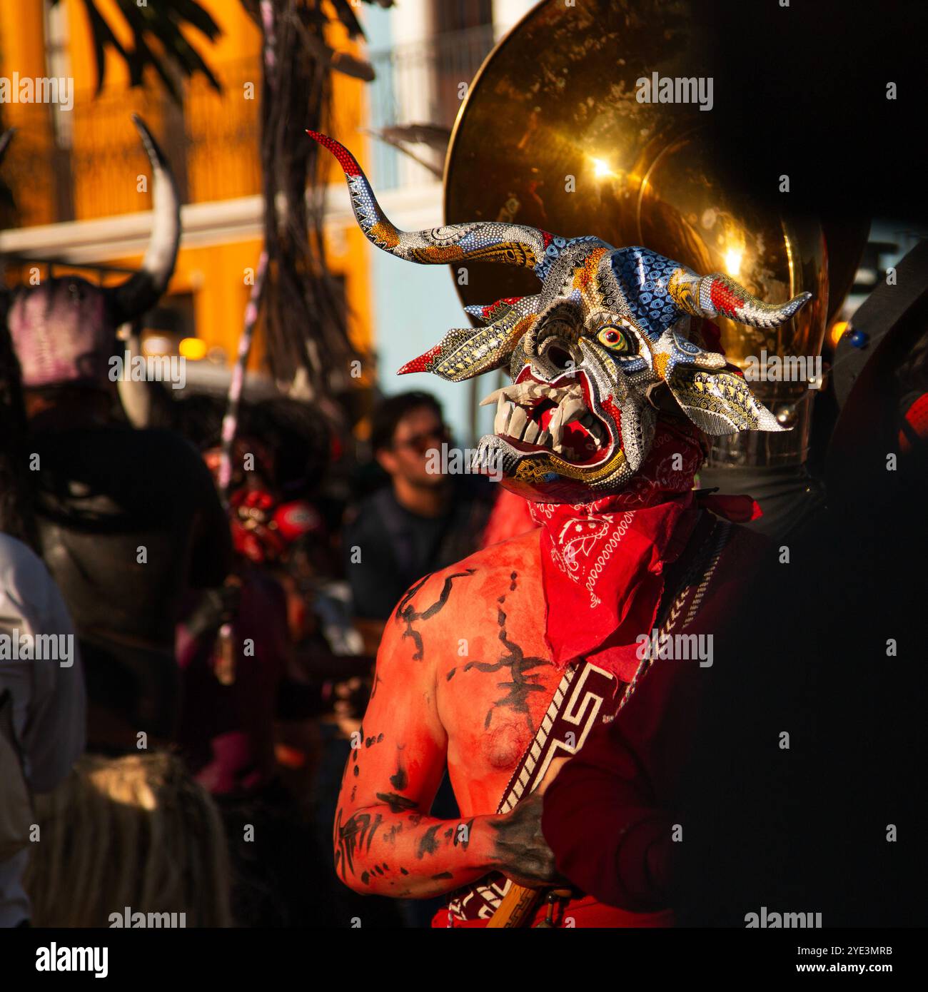 Masked man in a carnival parade in Oaxaca Mexico Stock Photo