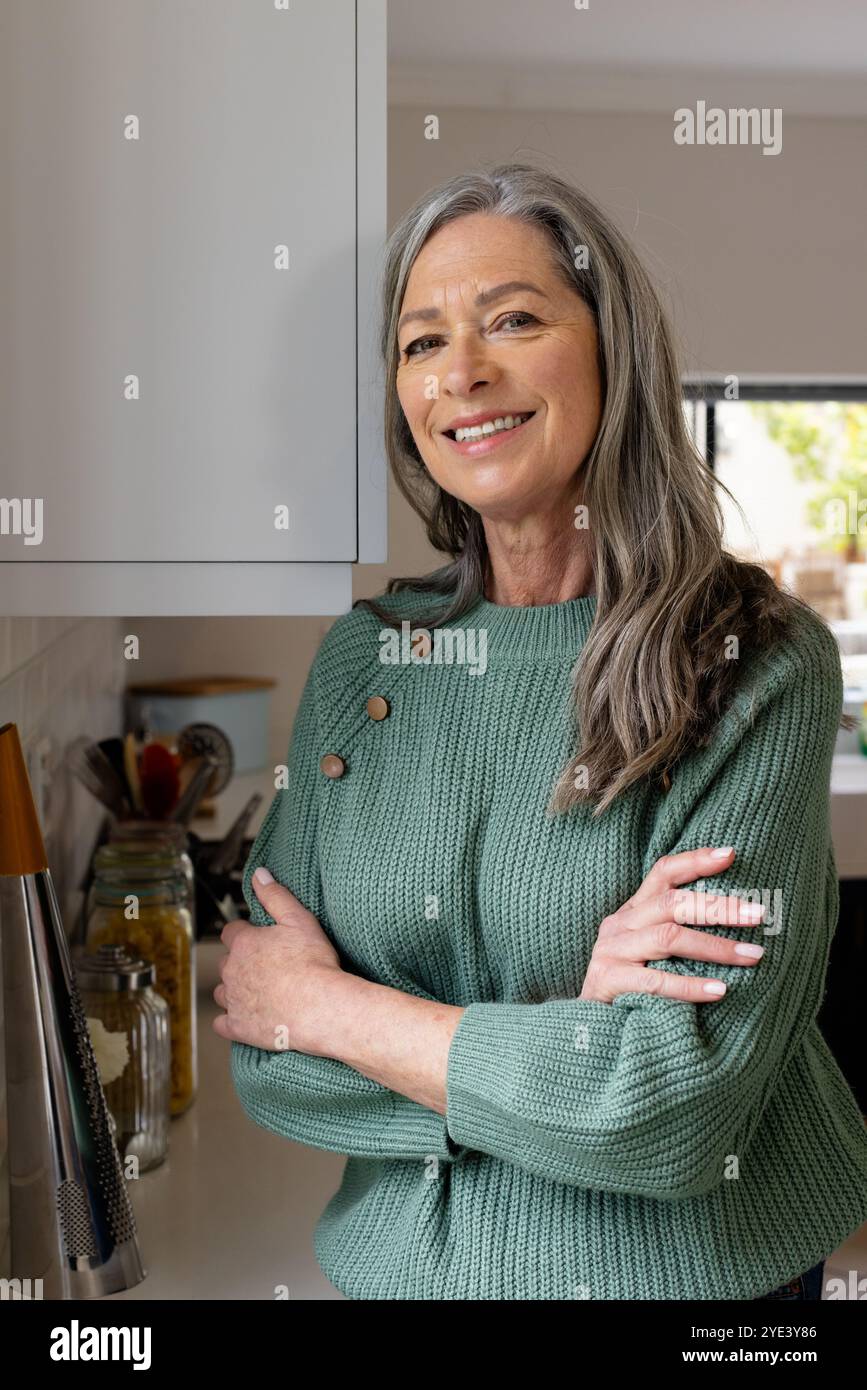 Positive mature woman standing hi-res stock photography and images - Alamy