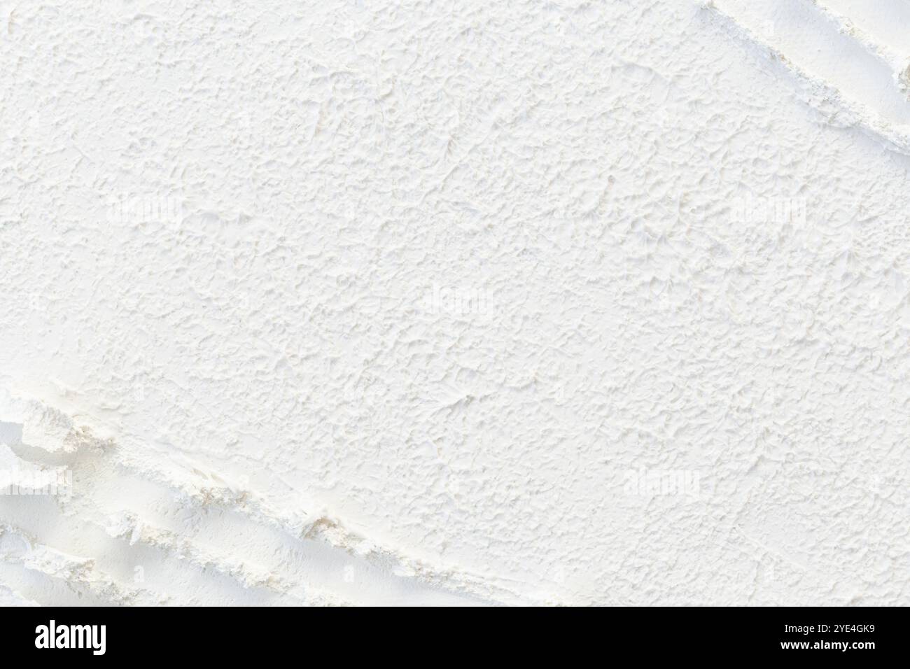 Close-up of abstract uneven and rough surface made of white molding ...