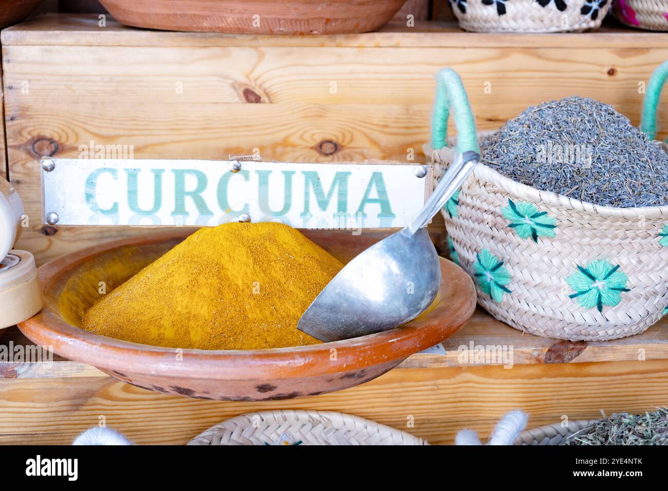 Marrakesh Morocco Curcuma or Turmeric powder in China bowl for sale in a medina souk stall. A spice used as a food colouring and flavoring Stock Photo