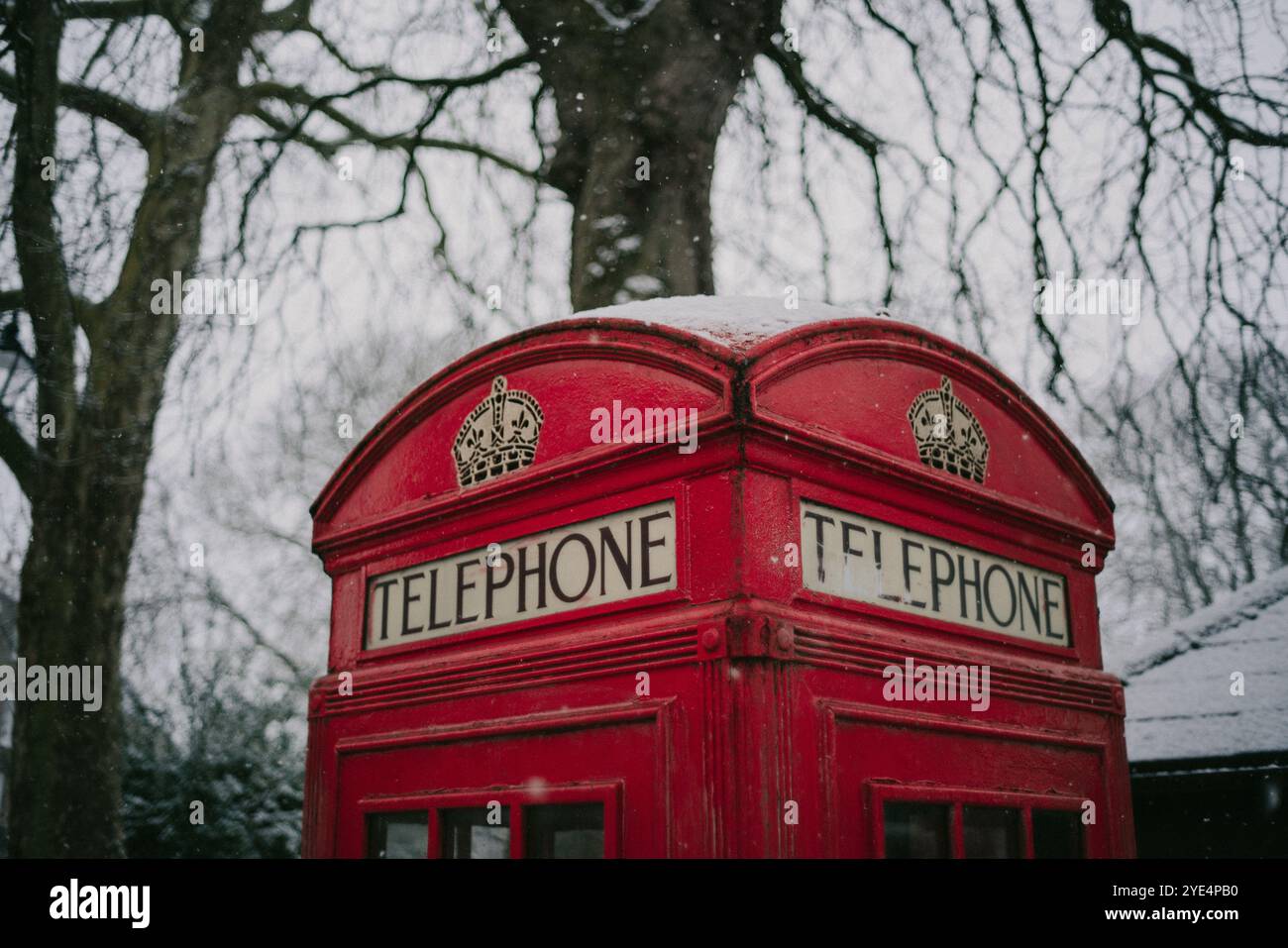 Iconic London red telephone booth under the snow in winter Stock Photo ...