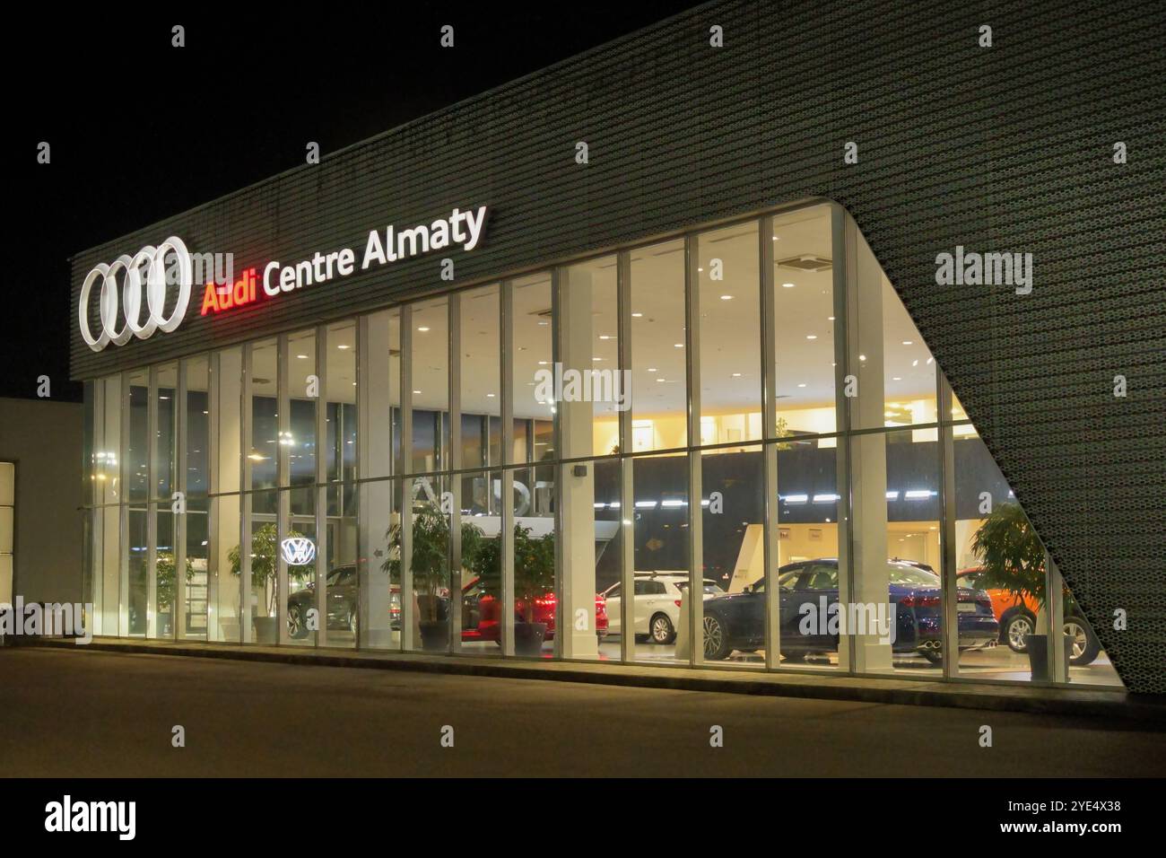 Almaty, Kazakhstan - October 18, 2024: Car dealership center Audi. Official distributor. Night time Stock Photo