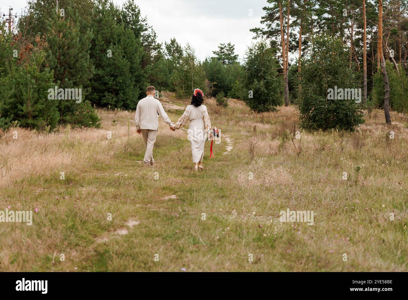 Romantic Couple Walking Hand in Hand Through Enchanted Forest Pathway ...