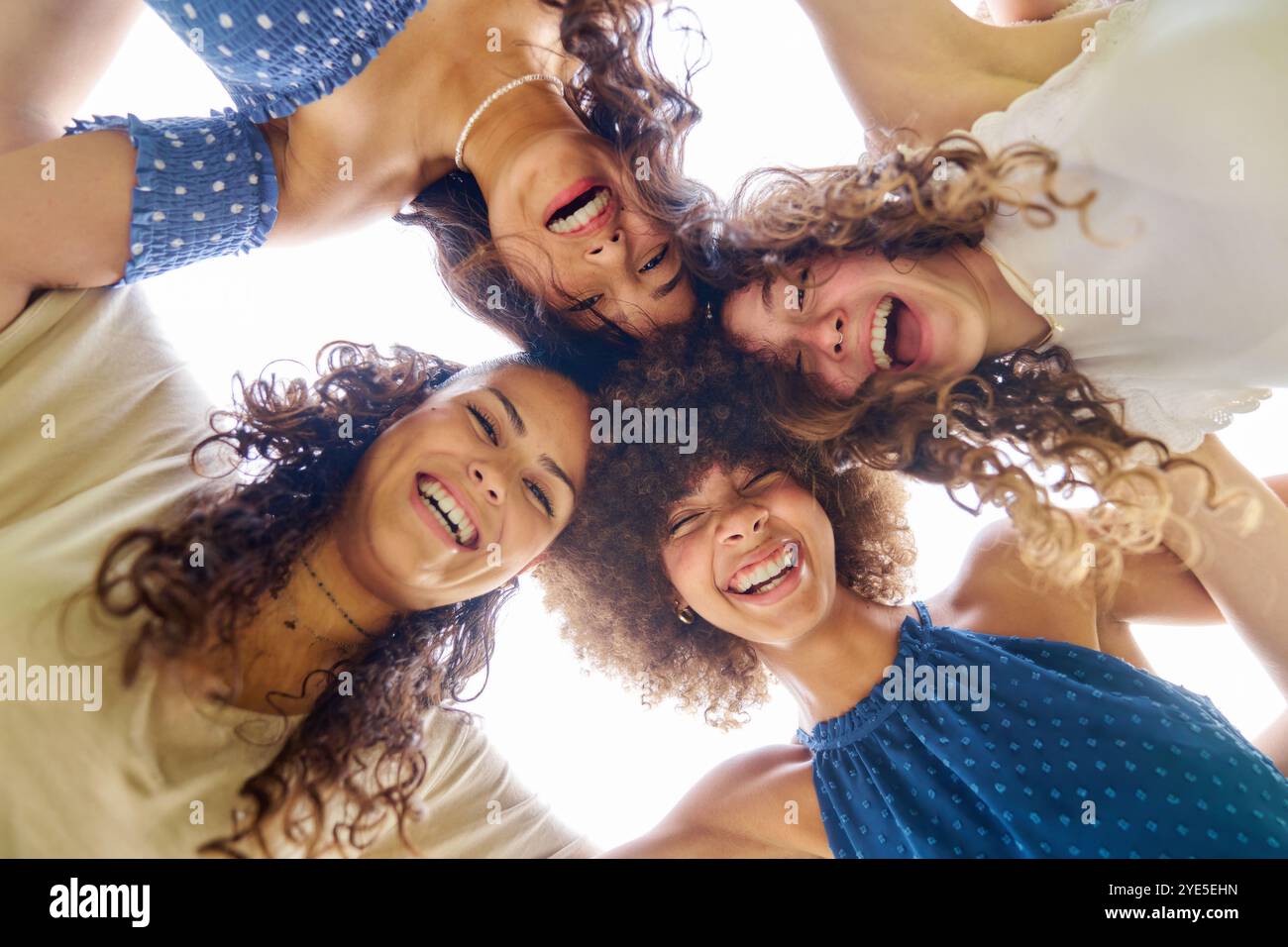 Four women hugging hi-res stock photography and images - Alamy