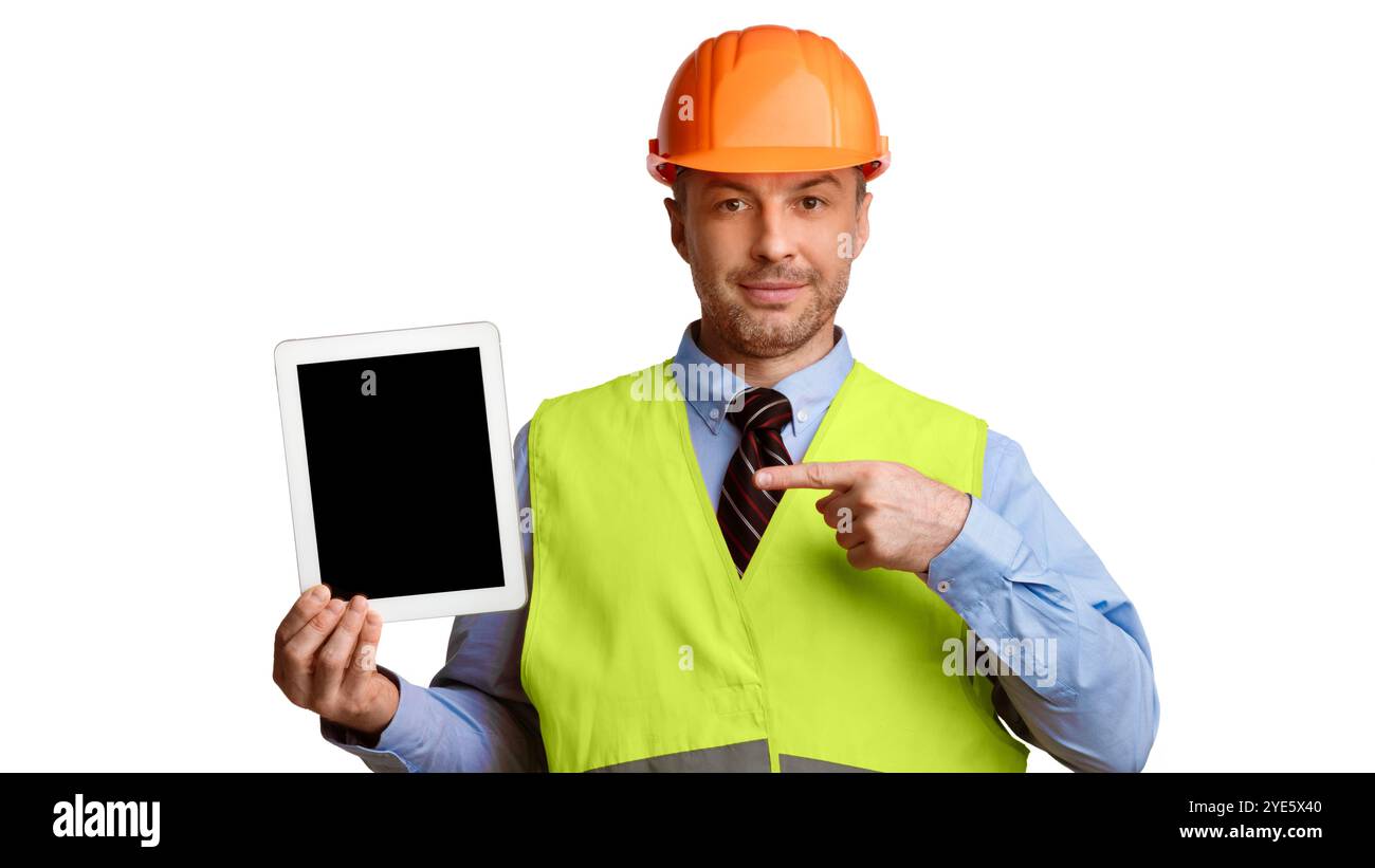 Builder Showing Tablet Computer Pointing Finger At Screen, White Background Stock Photo