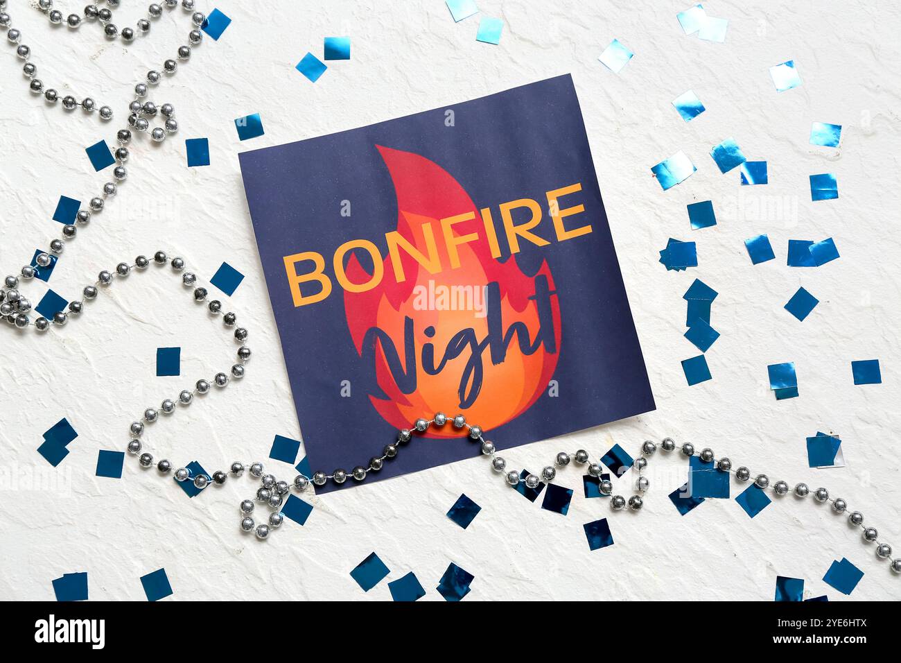 Greeting card for Guy Fawkes night with confetti and beads on light ...