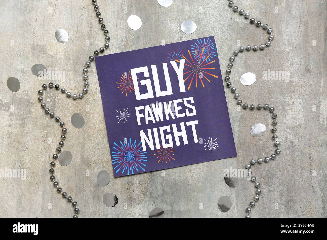 Greeting card for Guy Fawkes night with confetti and beads on grey ...