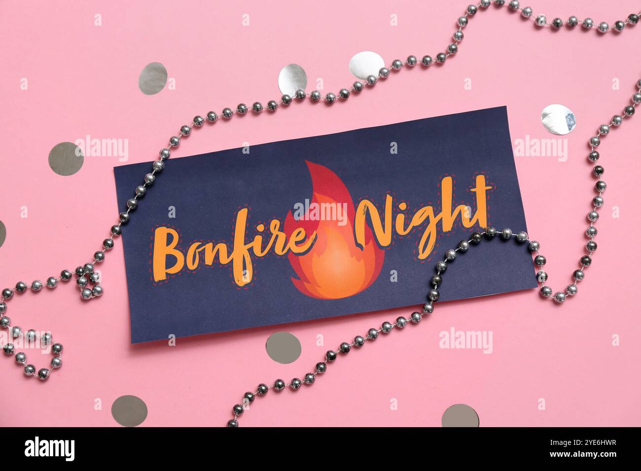 Greeting card for Guy Fawkes night with confetti and beads on pink ...