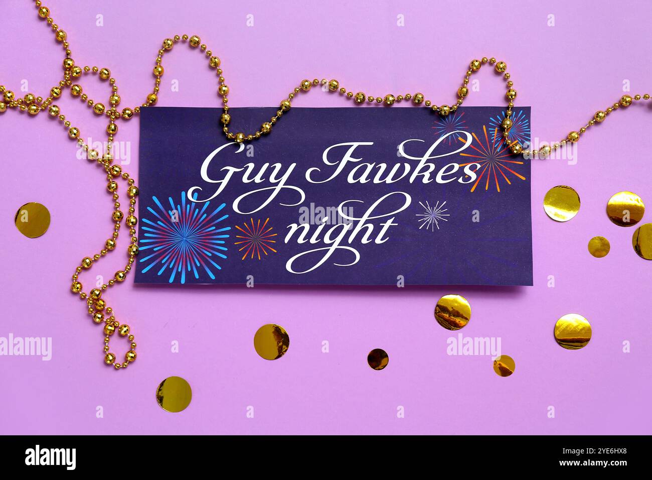 Greeting card for Guy Fawkes night with confetti and beads on purple ...