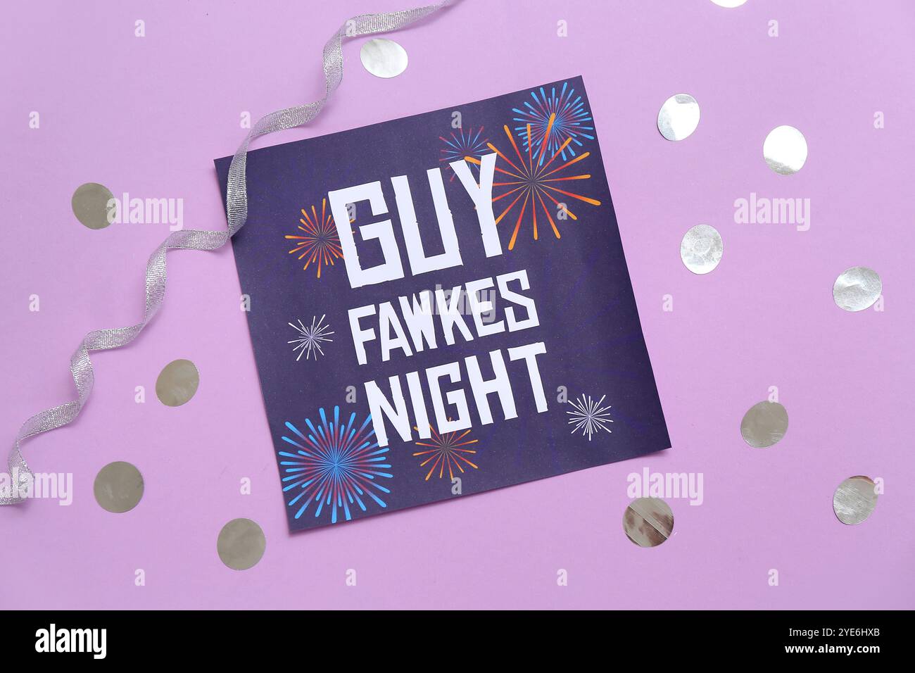 Greeting card for Guy Fawkes night with ribbon and confetti on purple ...