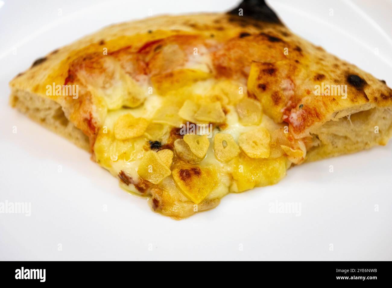 Traditional rustic pizza made with four cheeses, garlic and oil and ...
