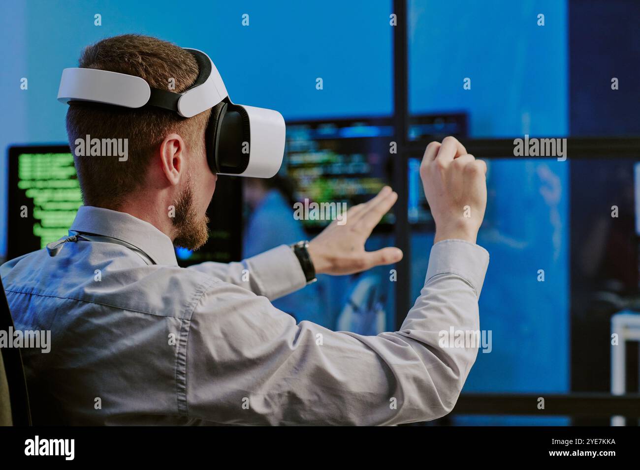 Man Using Virtual App At Work Stock Photo