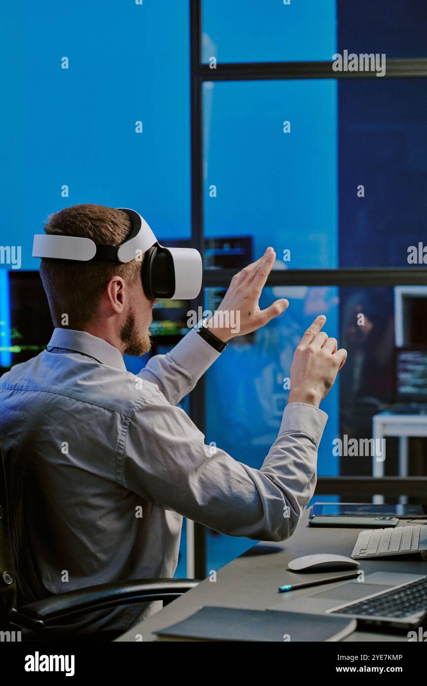 Man Using Virtual Technologies At Work Stock Photo