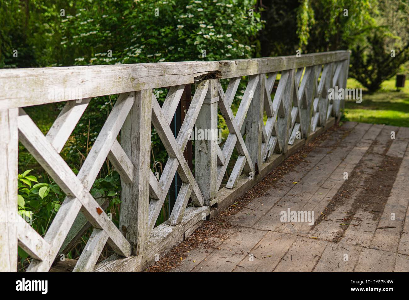 Old wooden bridge with white painted railings Stock Photo - Alamy