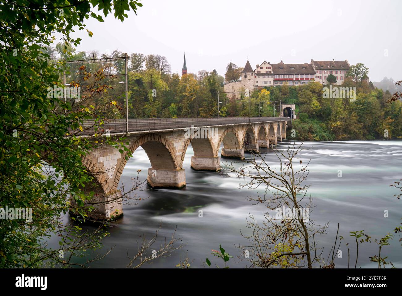 Rheinbrücke bei Laufen bridge at the beautiful Swiss Rhine Falls, seen during the fall time. Schaffhausen *** Rheinbrücke bei Laufen bridge at the beautiful Swiss Rhine Falls, seen during the fall time Schaffhausen Stock Photo