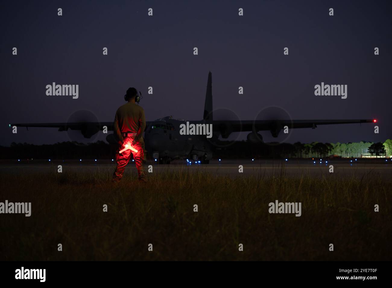 A 4th Special Operations Aircraft Maintenance Squadron crew chief stands by to marshal an AC-130J Ghostrider gunship at Hurlburt Field, Florida, Oct. Stock Photo