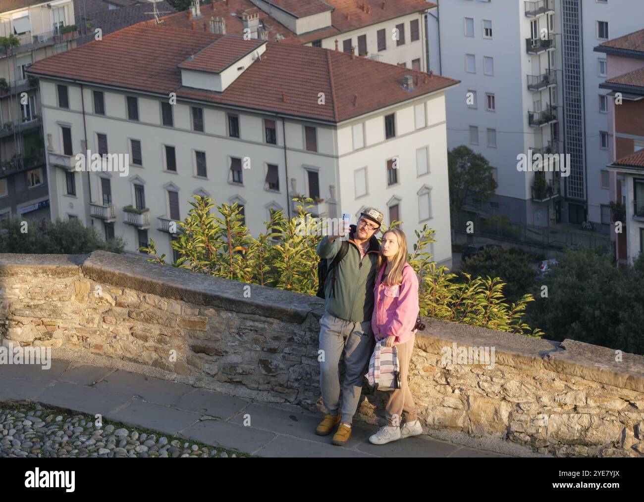 Porta San Giacomo Bergamo where many tourists immortalize selfies and souvenir photos with the beautiful landscape from the Venetian walls. Stock Photo