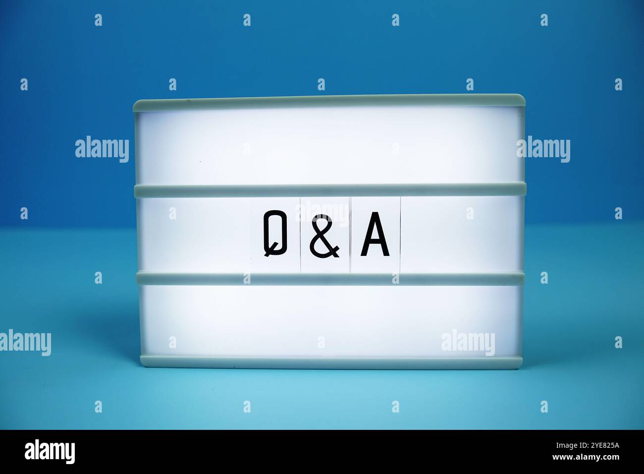 Q & A (Question and Answer) letterboard text on LED Lightbox on blue background Stock Photo