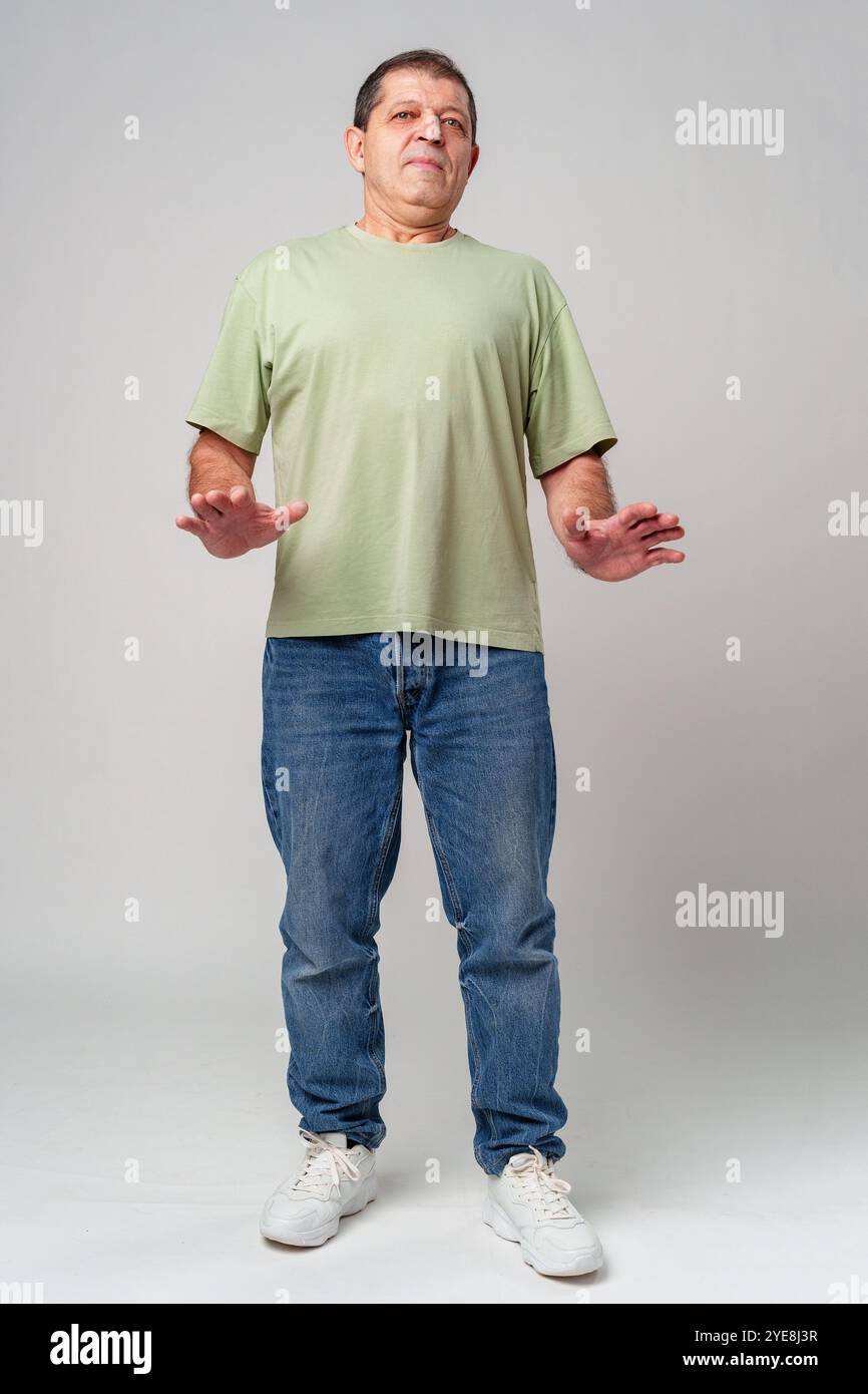 Man wearing plain blue shirt hi-res stock photography and images - Alamy