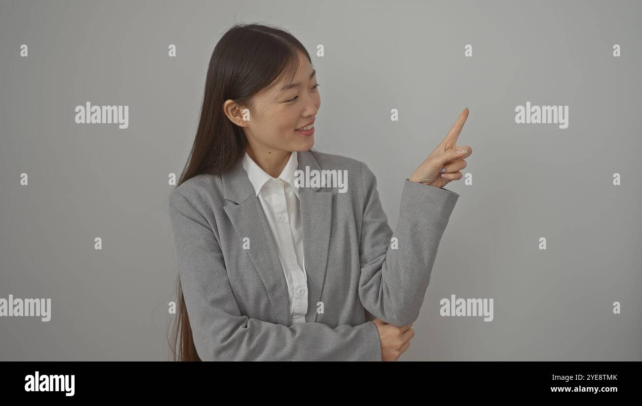 Asian woman pointing upwards hi-res stock photography and images - Alamy