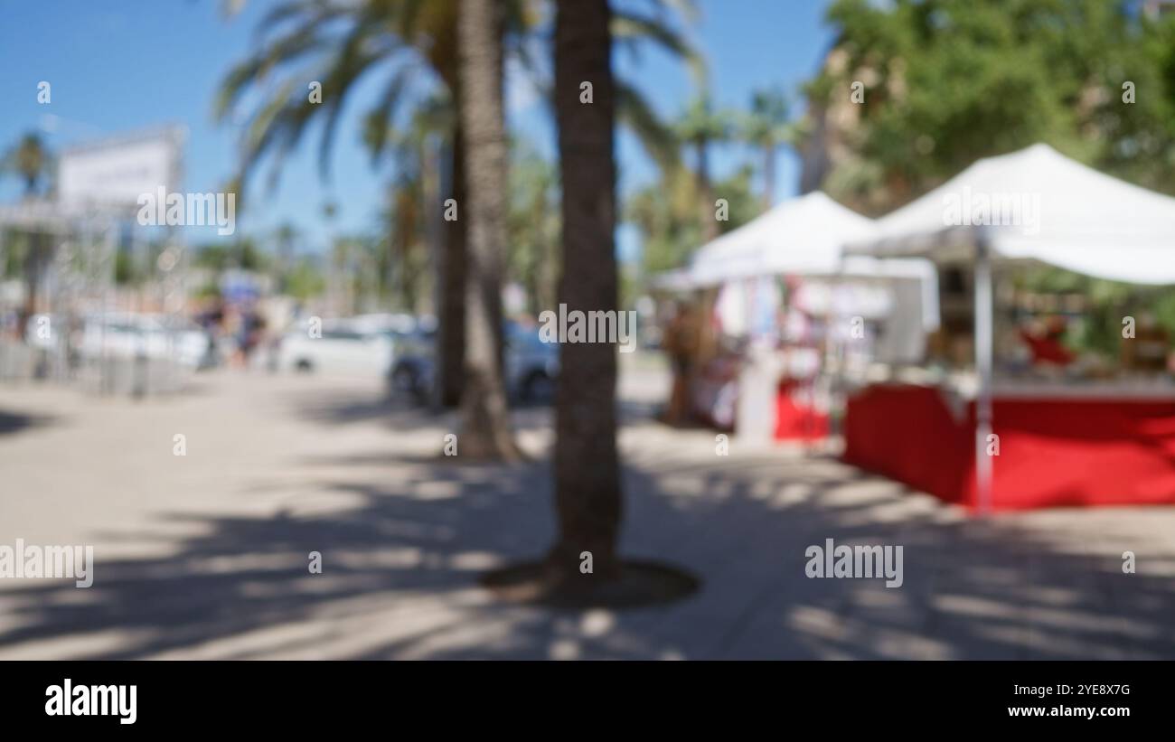 Blurred view of an outdoor market in mallorca with defocused people and ...