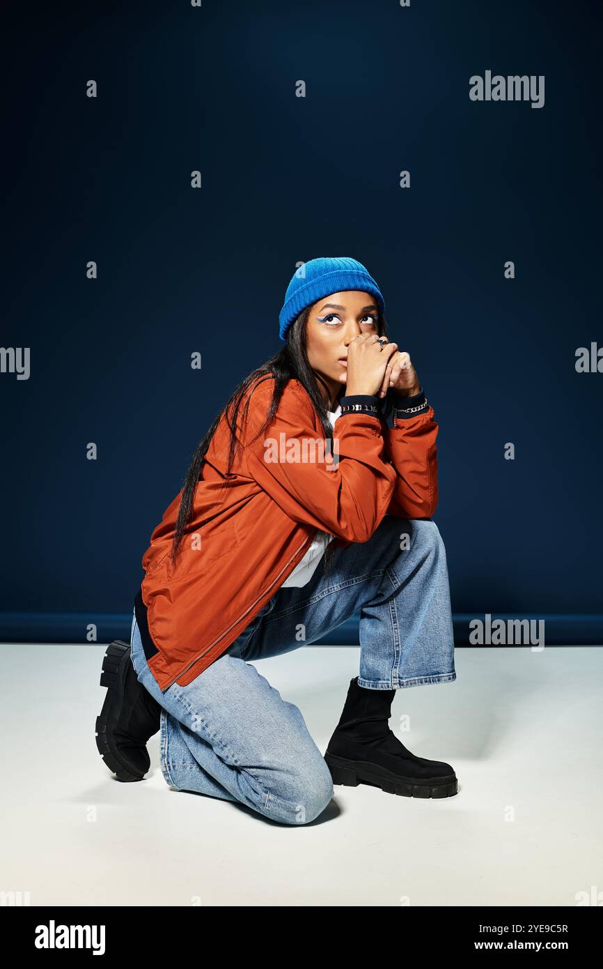 Dark outfit crouches hi-res stock photography and images - Alamy