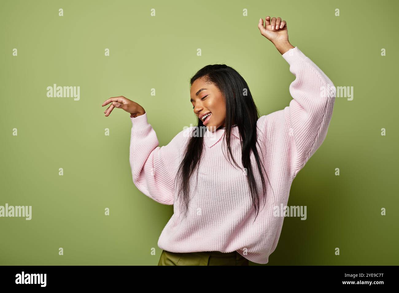 Carefree woman dances against background hi-res stock photography and ...