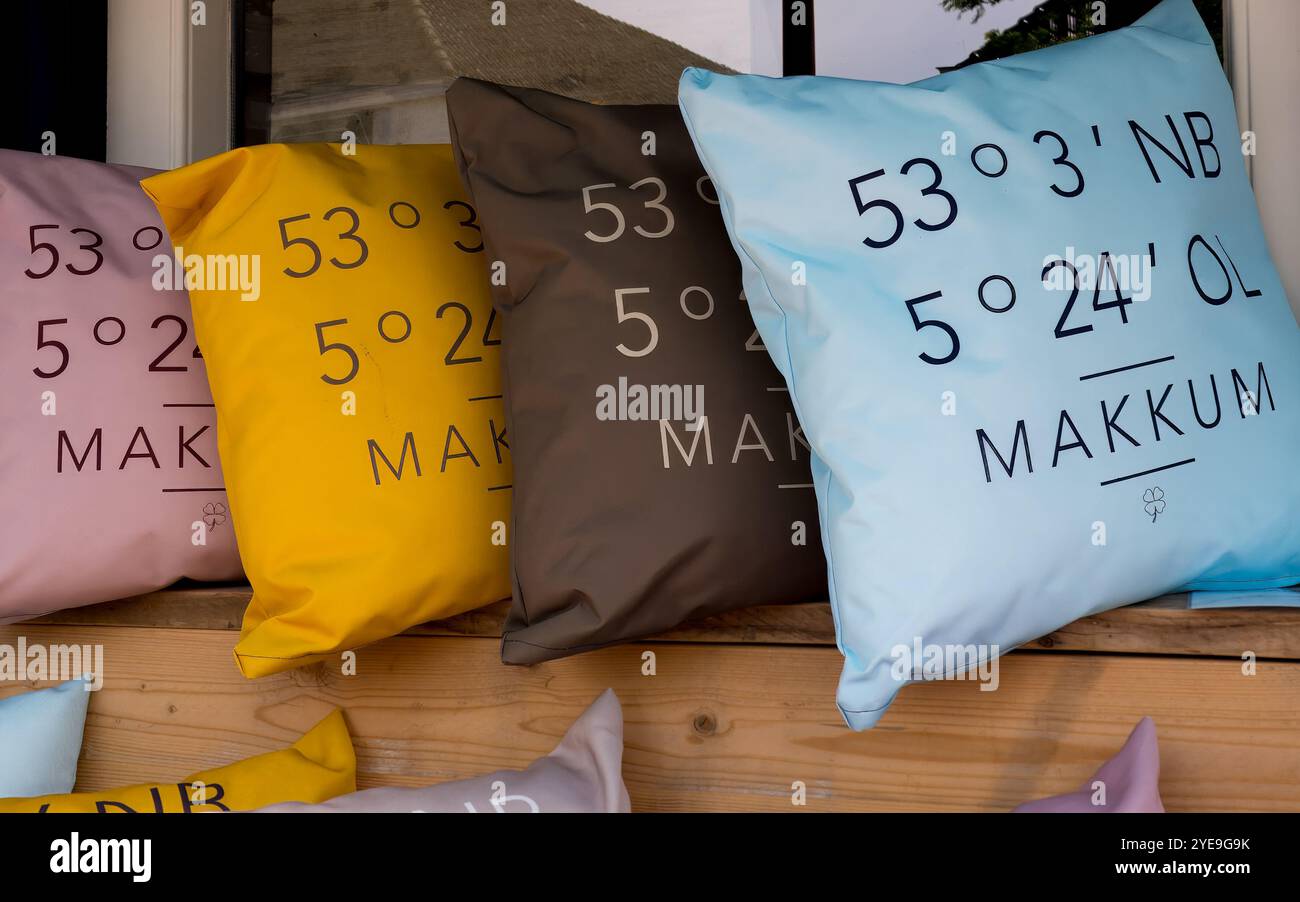 Decorative pillows with geographical coordinates, souvenirs of small town of Makkum, Friesland, Netherlands Stock Photo