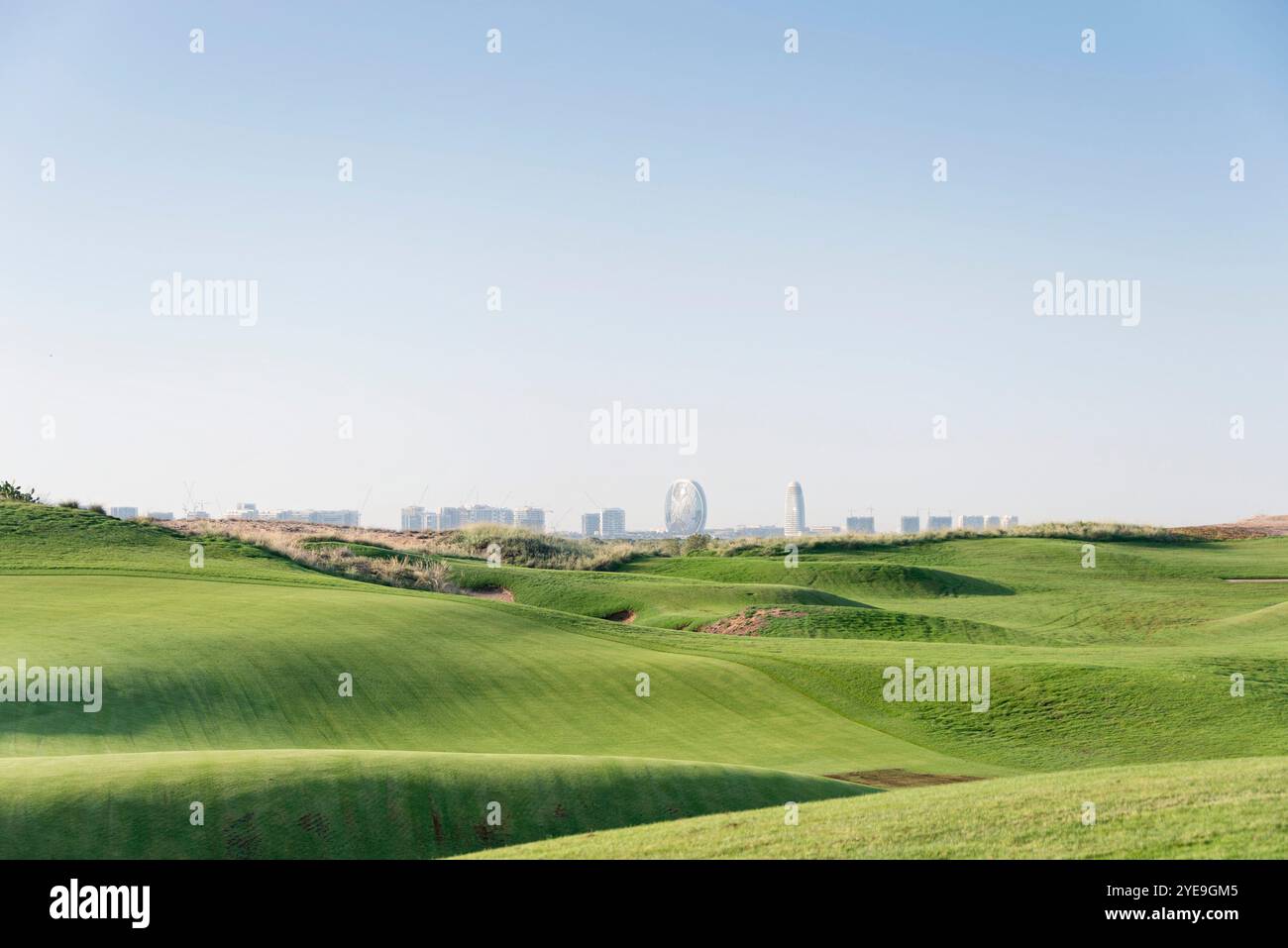 Golf course with challenging hills on a sunny day Stock Photo